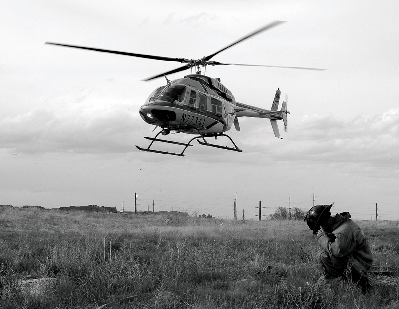 Heli coming down and Photographer taking photos